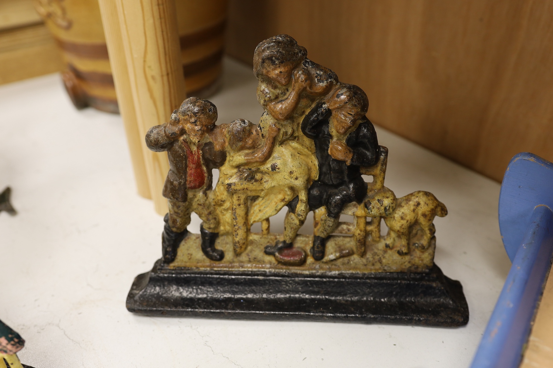 A painted ply Noah's Ark with animals, two Victorian iron door stops, a painted toleware cockerel and an oil on canvas of a harbour view. Condition - varies